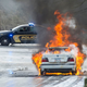 A burning BMW. Photo credit AP